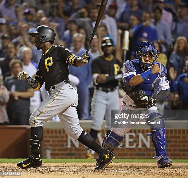 Willson Contreras of the Chicago Cubs celebrates after Andrew McCutchen of the Pittsburgh Pirates stirkes out with the bases loaded to end the top...