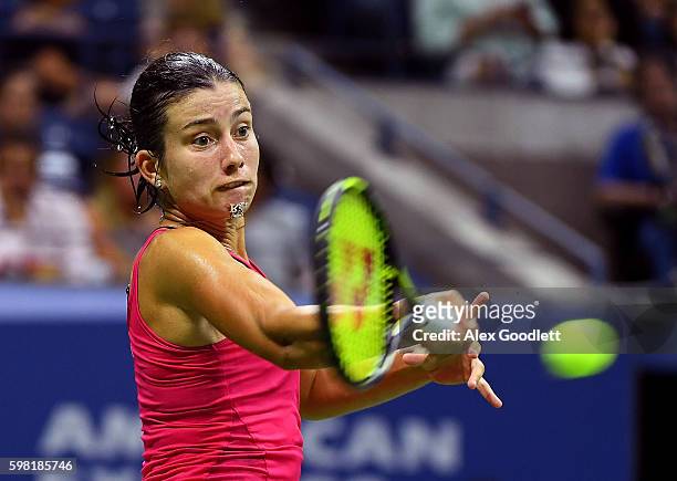 Anastasija Sevastova of Lativa returns a shot to Garbine Muguruza of Spain during her second round Women's Singles match on Day Three of the 2016 US...