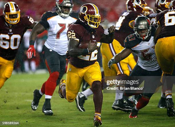 Cornerback Deshazor Everett of the Washington Redskins runs for a first down during the third quarter of an NFL preseason game against the Tampa Bay...