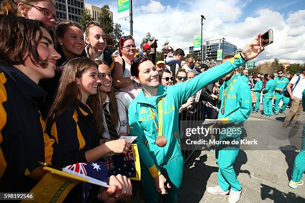 Anna Meares takes a selfie with spectators during Welcome Home celebrations for the Australian Olympic Games Team at Victoria Square on September 1,...