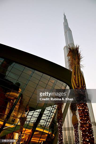 The dhow-shaped Dubai Opera on opening night dots the skyline alongside the iconic Burj Khalifa on August 31, 2016 in Dubai, United Arab Emirates.