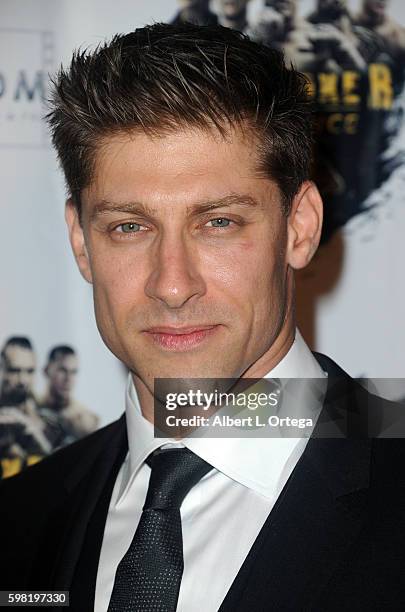 Actor Alain Moussi arrives for the Premiere Of RLJ Entertainment's "Kickboxer: Vengeance" held at iPic Theaters on August 31, 2016 in Los Angeles,...