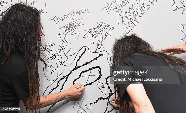Musicians James "Munky" Shaffer and Jonathan Davis of Korn attend the BUILD Series to discuss the band's newest studio album "The Serenity Of...