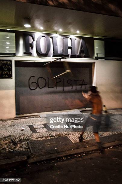 The HQ of Brazil's main newspaper, Folha de Sao Paulo, is attacked by demonstrators who accuse the publication to support DIlma Rousseff's...