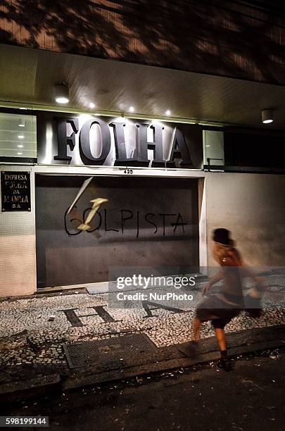 The HQ of Brazil's main newspaper, Folha de Sao Paulo, is attacked by demonstrators who accuse the publication to support DIlma Rousseff's...