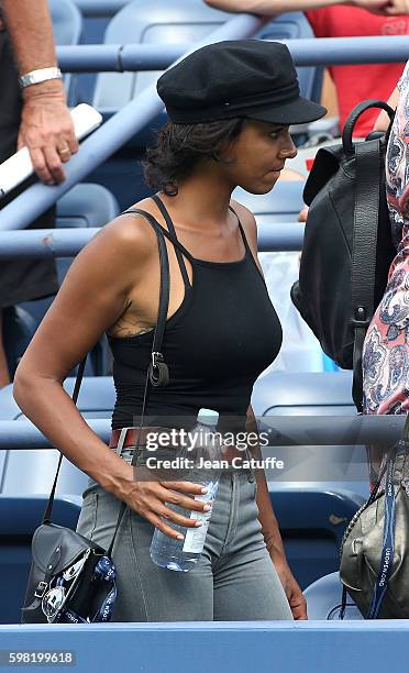 Shy'm attends the defeat of Benoit Paire of France in 4 sets in the second round on day 3 of the 2016 US Open at USTA Billie Jean King National...