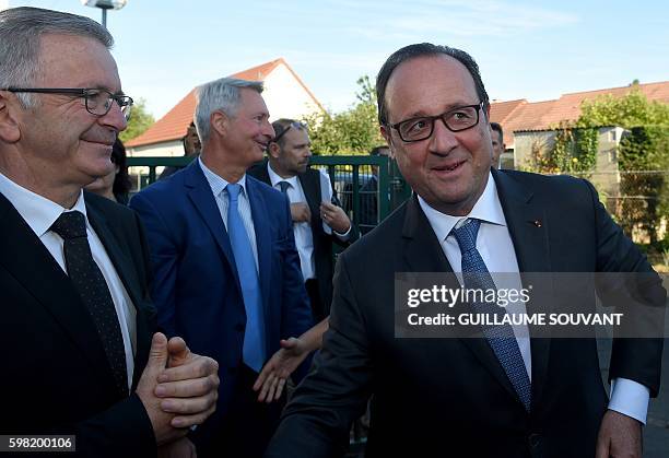 French President Francois Hollande arrives for a visit of the primary school Nécotin and the high school Jean Rostand during the first day of the...