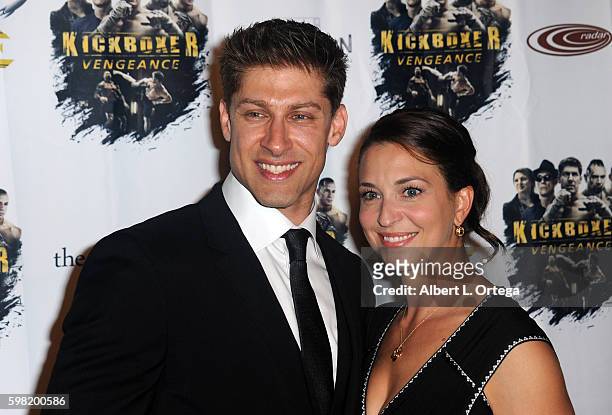Actor Alain Moussi and wife Janie Des Rosiers arrive for the Premiere Of RLJ Entertainment's "Kickboxer: Vengeance" held at iPic Theaters on August...