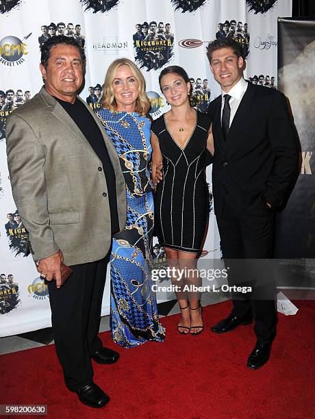 Producer/writer Dimitri Logothetis Janie Des Rosiers and fighter/actor Alain Moussi arrive for the Premiere Of RLJ Entertainment's "Kickboxer:...
