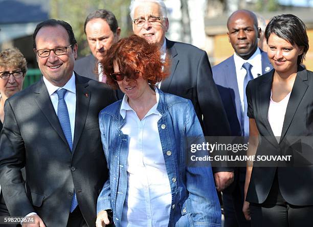 French President Francois Hollande , director of the school , and French Minister of Education Najat Vallaud-Belkacem visit the high school Jean...