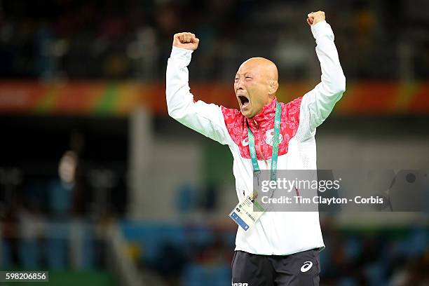 Day 12 Japanese coach Kazuhito Sakae celebrates the dramatic last second victory of Eri Tosaka of Japan against Mariya Stadnik of Azerbaijan during...