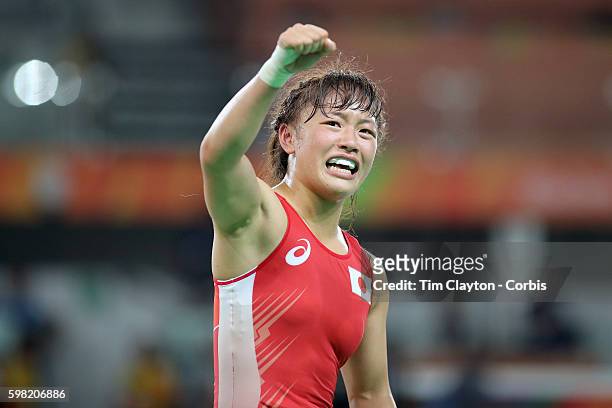 Day 12 Eri Tosaka of Japan celebrates her dramatic last second victory against Mariya Stadnik of Azerbaijan during their Women's Freestyle 48 kg Gold...