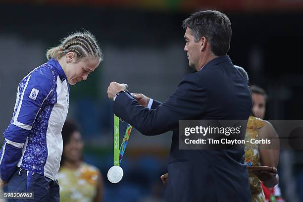 Day 12 Mariya Stadnik of Azerbaijan cries on the podium after losing in the last seconds of her bout with Eri Tosaka of Japan during their Women's...