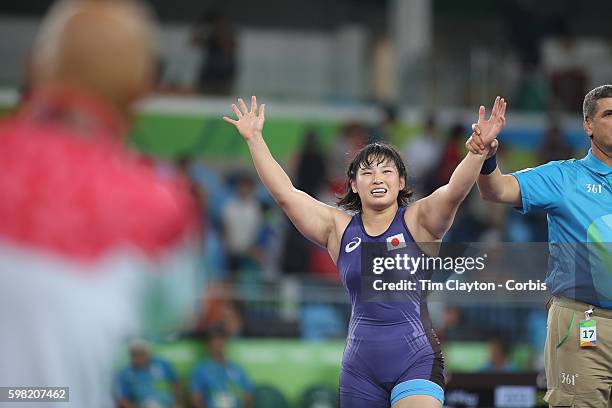 Day 12 Sara Dosho of Japan celebrates victory with coach Kazuhito Sakae over Natalia Vorobeva of Russia during their Women's Freestyle 69 kg Gold...