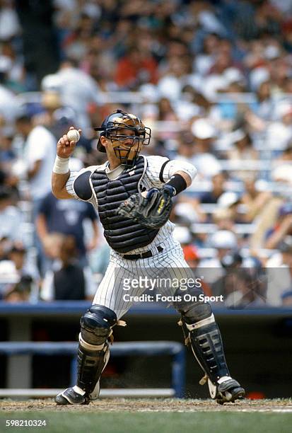 Jim Leyritz of the New York Yankees in looks to throw down to second base during an Major League Baseball game circa 1996 at Yankee Stadium in the...