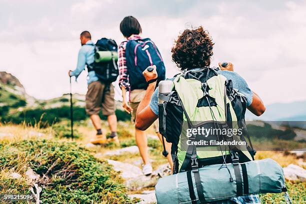 friends hiking in the mountain - camping equipment stock pictures, royalty-free photos & images