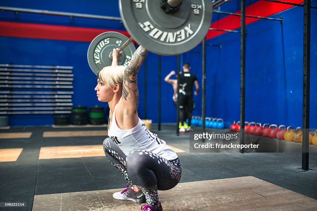 Woman doing a strong training gym weightlifting