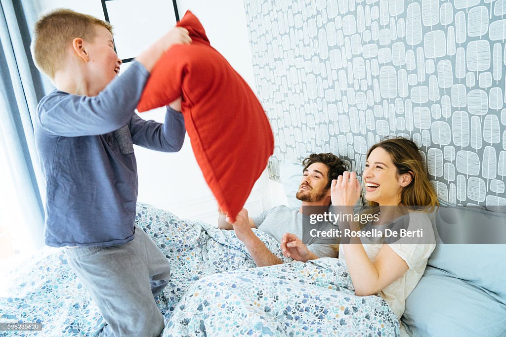 Happy Family Waking Up In The Morning, Playing in Bed