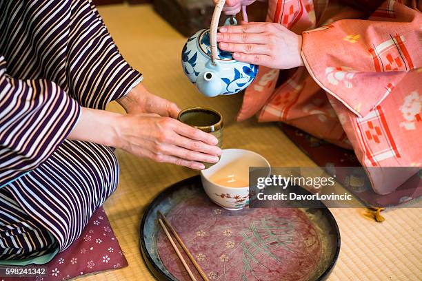 dertail of having traditional japanese tea in kyoto japan - cerimónia imagens e fotografias de stock