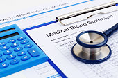 Medical bill and insurance form with calculator