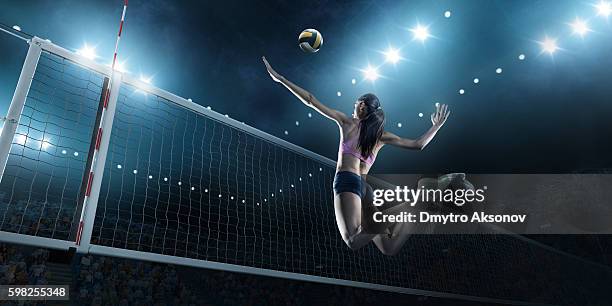 volleyball: female player in action - taking a shot sport stockfoto's en -beelden