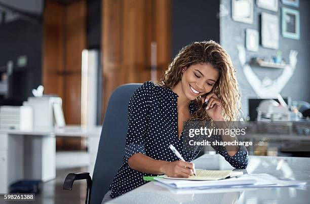 taking notes of her business call - professional writer stock pictures, royalty-free photos & images