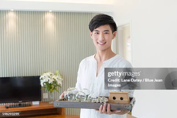traditional chinese medical massagist - massage uniform stock pictures, royalty-free photos & images