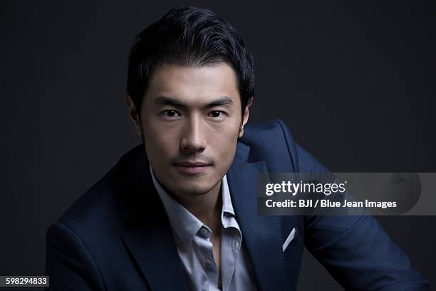portrait of confident businessman - wealthy asian man stock pictures, royalty-free photos & images