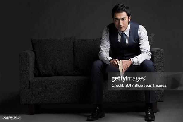 portrait of confident businessman - suit waistcoat stock pictures, royalty-free photos & images