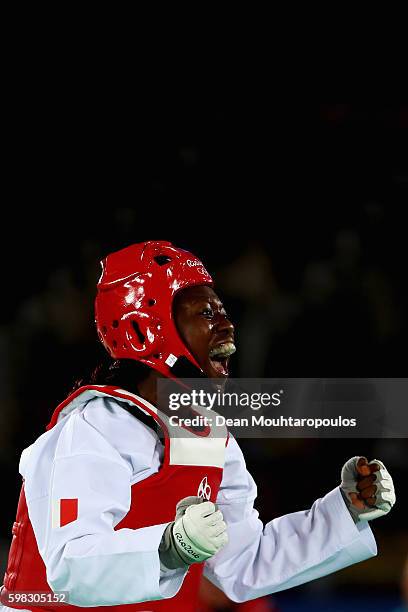 Haby Niare of France celebrates victory against Nur Tatar of Turkey after they compete in their Women's -67kg Taekwondo semifinal bout on Day 14 of...