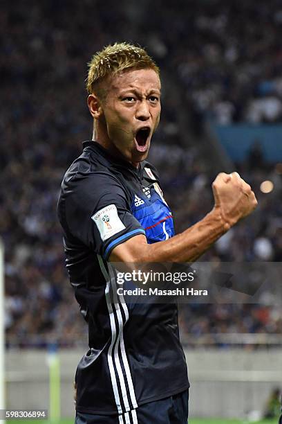 Keisuke Honda of Japan celebrates the first goal during the 2018 FIFA World Cup Qualifiers Group B match between Japan and United Arab Emirates at...