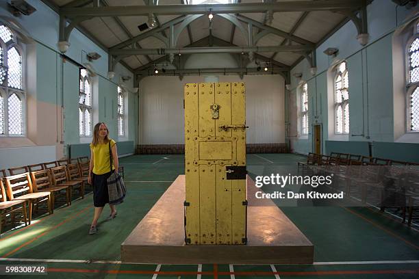 Visitor looks at former inmate Oscar Wilde's prison cell door on display in the prison Chapel on September 1, 2016 in Reading, England. The former...
