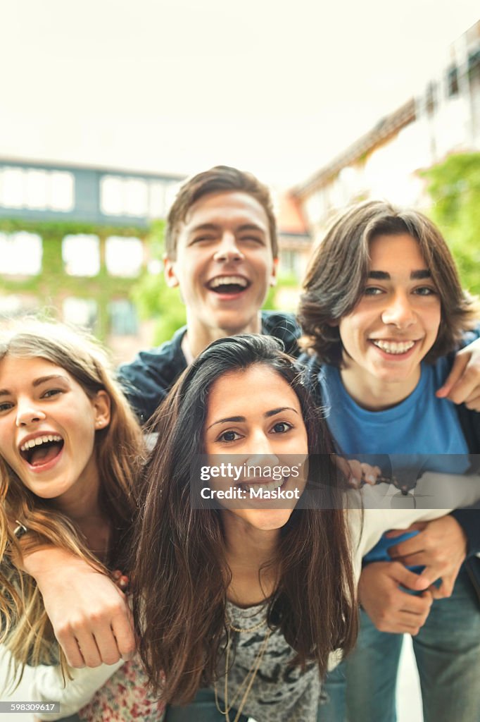 Portrait of happy teenagers enjoying outdoors