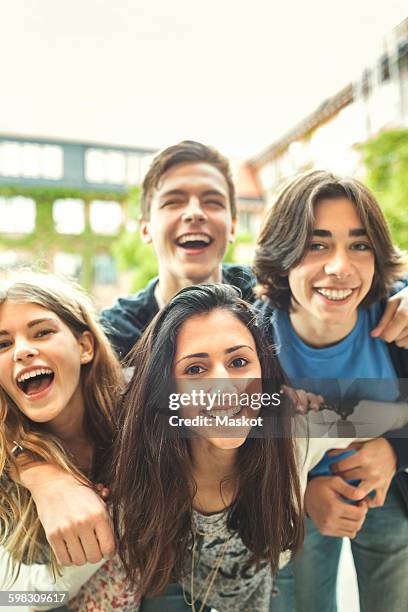 portrait of happy teenagers enjoying outdoors - alleen tieners stockfoto's en -beelden