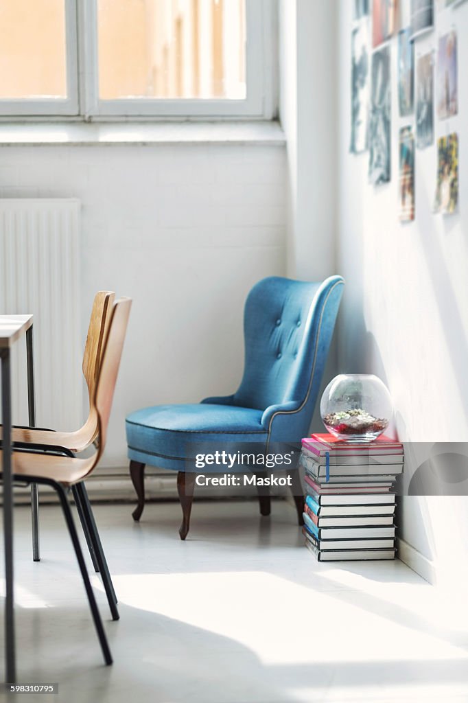 Stack of books and chairs in office