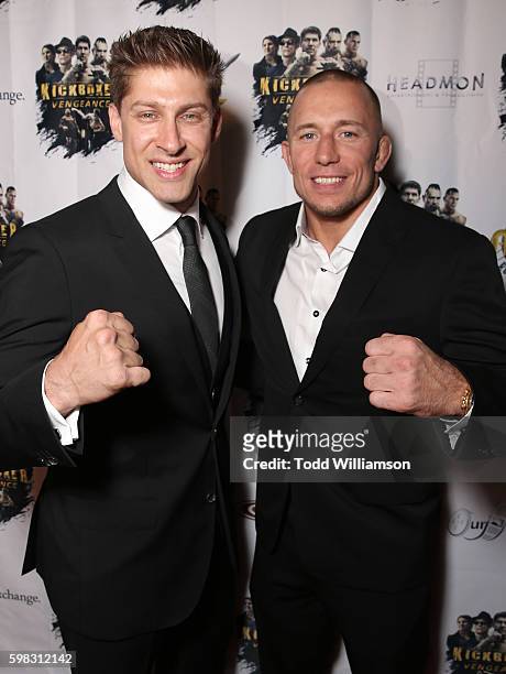 Alain Moussi and Georges St-Pierre attend the premiere Of RLJ Entertainment's "Kickboxer: Vengeance" at iPic Theaters on August 31, 2016 in Los...