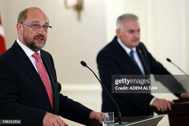 President of the European Parliament Martin Schulz delivers a speech next to Turkish Prime Minister Binali Yildirim during a joint press conference...