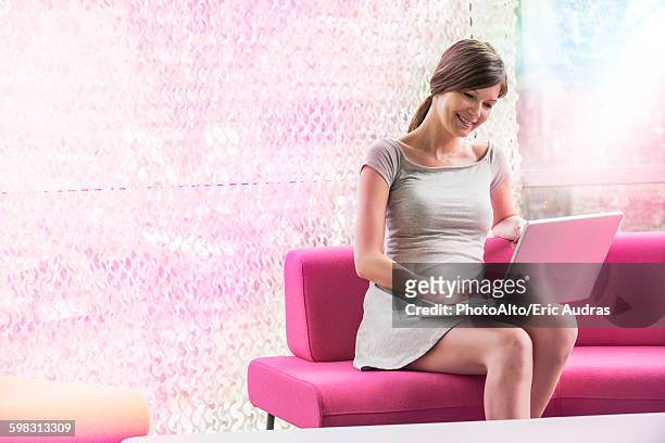 woman at home using laptop computer - easy load stock pictures, royalty-free photos & images