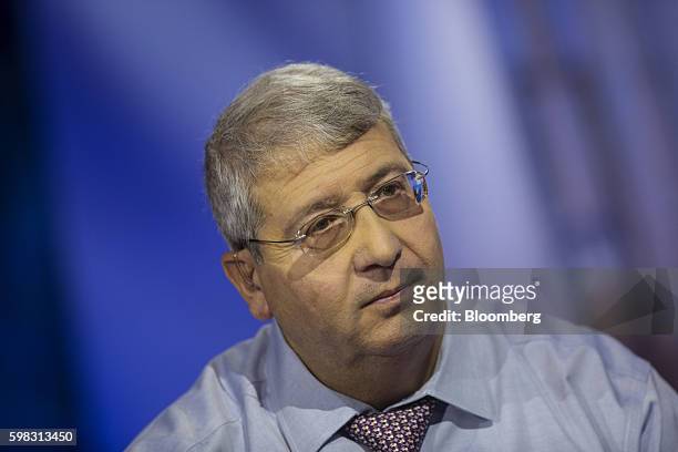 Steven Ricchiuto, chief economist for Mizuho Securities USA Inc., listens during a Bloomberg Television interview in New York, U.S., on Thursday,...
