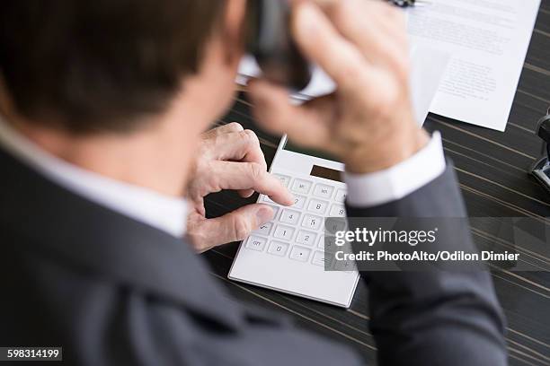 accountant reviewing financial accounts - whistleblower stock pictures, royalty-free photos & images