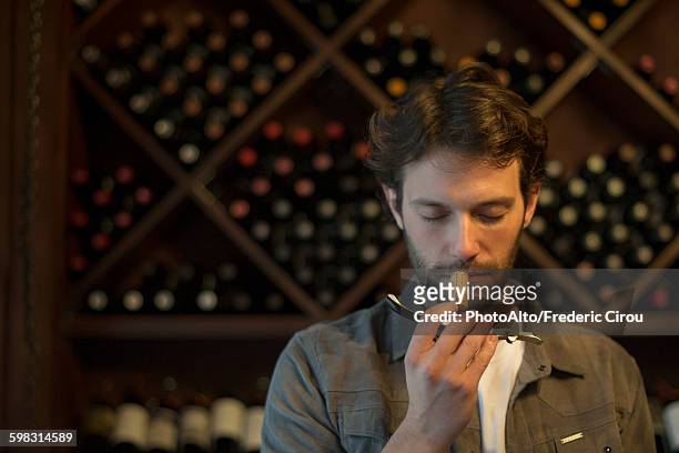 sommelier sniffing wine cork - wine cork stockfoto's en -beelden