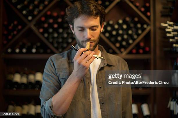 sommelier smelling wine cork - wine maker fotografías e imágenes de stock