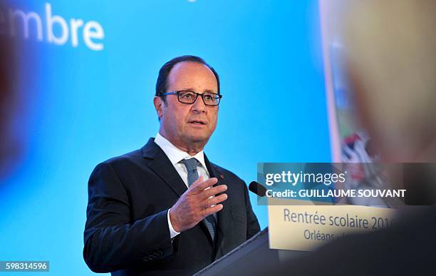 French President Francois Hollande gestures as he delivers a speech at the secondary school Jean Rostand during the first day of the starting of the...