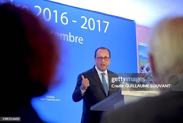 French President Francois Hollande gestures as he delivers a speech at the secondary school Jean Rostand during the first day of the starting of the...