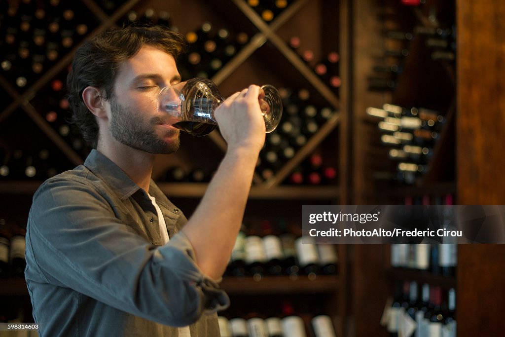 Sommelier tasting glass of wine