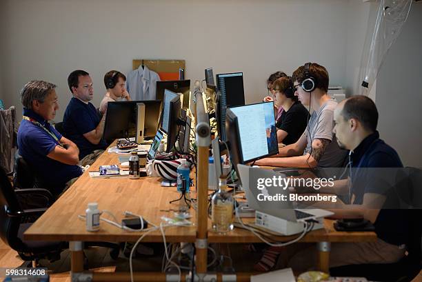 Employees of startup companies that got financial backing from Mistletoe Inc. Work in front of computer screens at the Mistletoe Base Camp Tokyo...