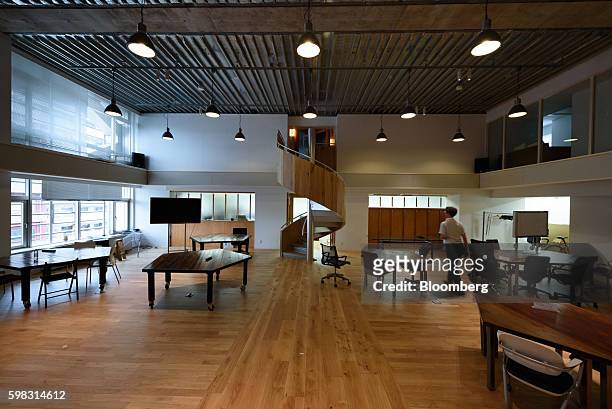 Person walks through the Mistletoe Base Camp Tokyo office, operated by Mistletoe, Inc., in Tokyo, Japan, on Tuesday, Aug. 30, 2016. When he launched...