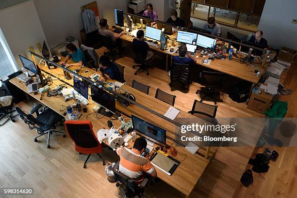 Employees of startup companies that got financial backing from Mistletoe Inc. Work in front of computer screens at the Mistletoe Base Camp Tokyo...