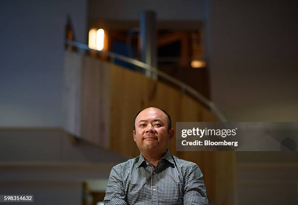 Taizo Son, chief executive officer of Mitletoe, Inc., sits for a photograph at the Mistletoe Base Camp Tokyo office, in Tokyo, Japan, on Tuesday,...
