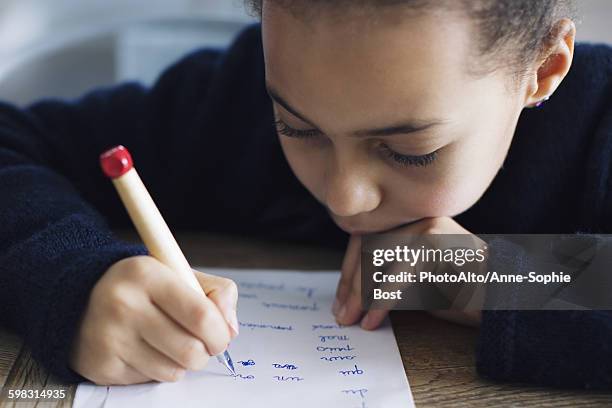 girl doing homework - learning difficulty stock pictures, royalty-free photos & images